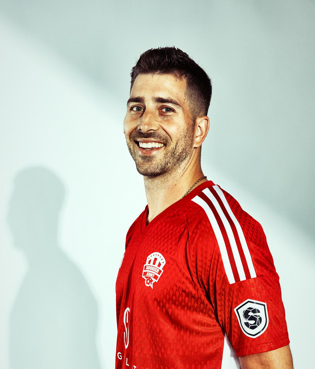 Zach Duke smiling in a red jersey