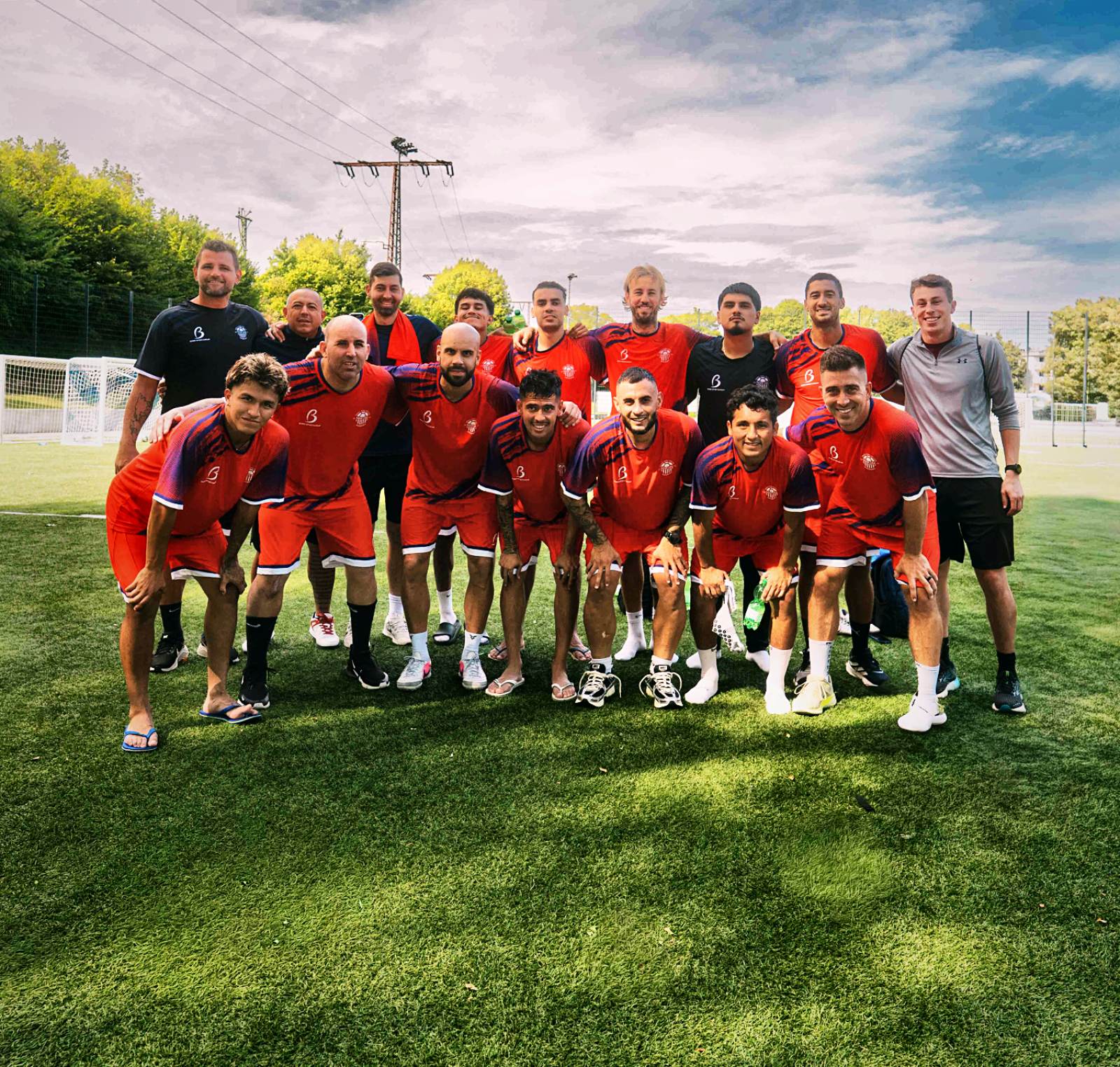 Team USA squad photo in red training kits in Germany